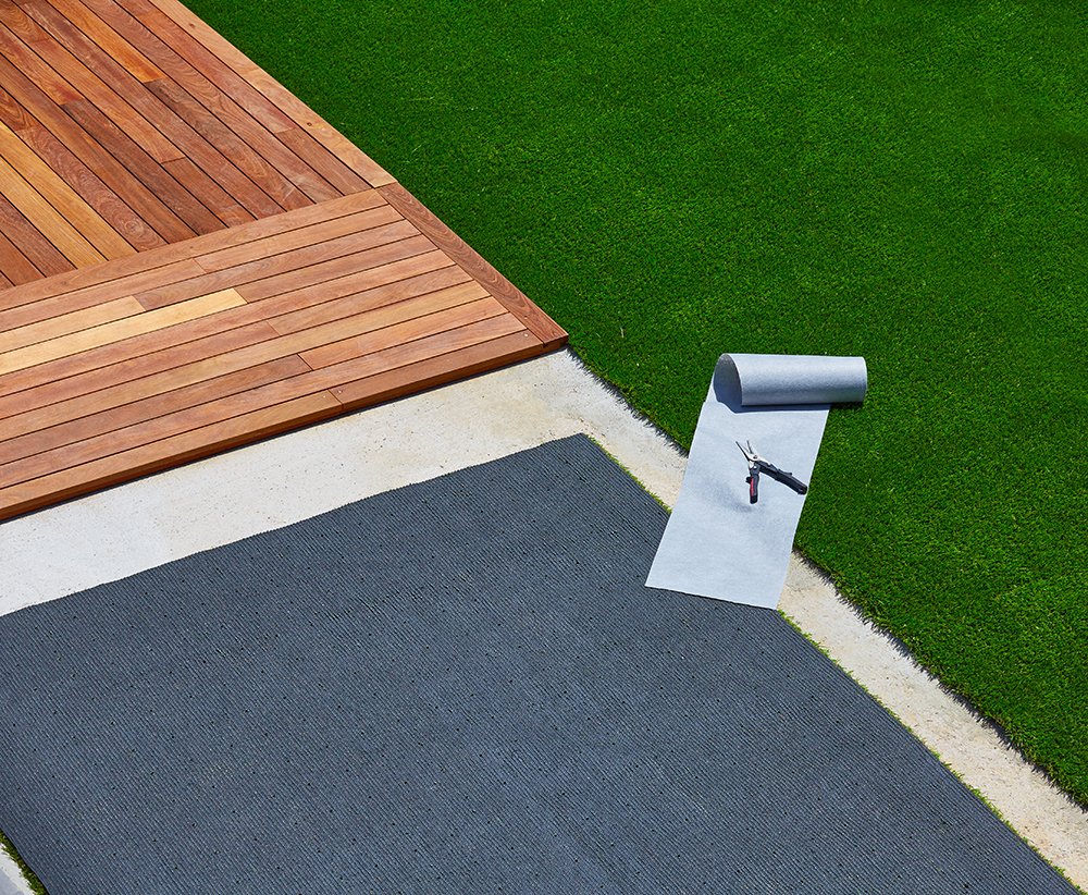 Laying weed mat for Synthetic Grass